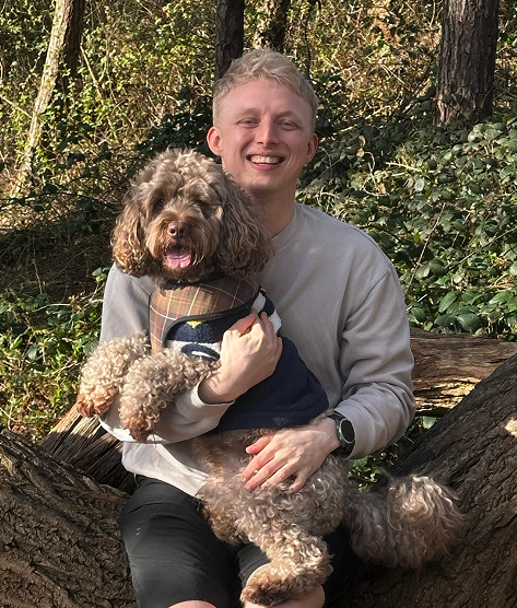 Sam Blake holding Pax